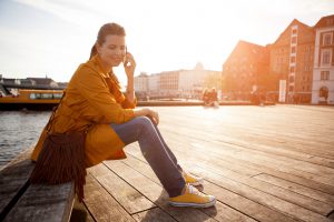 Woman in city using smart phone.